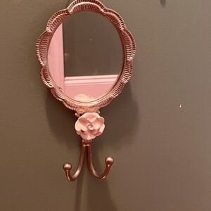 Vintage oval wall mirror with hooks